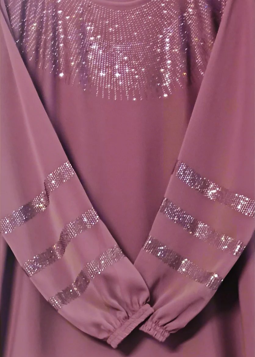 An onion pink abaya with stonework on the neckline and sleeves, displayed in a flat position.