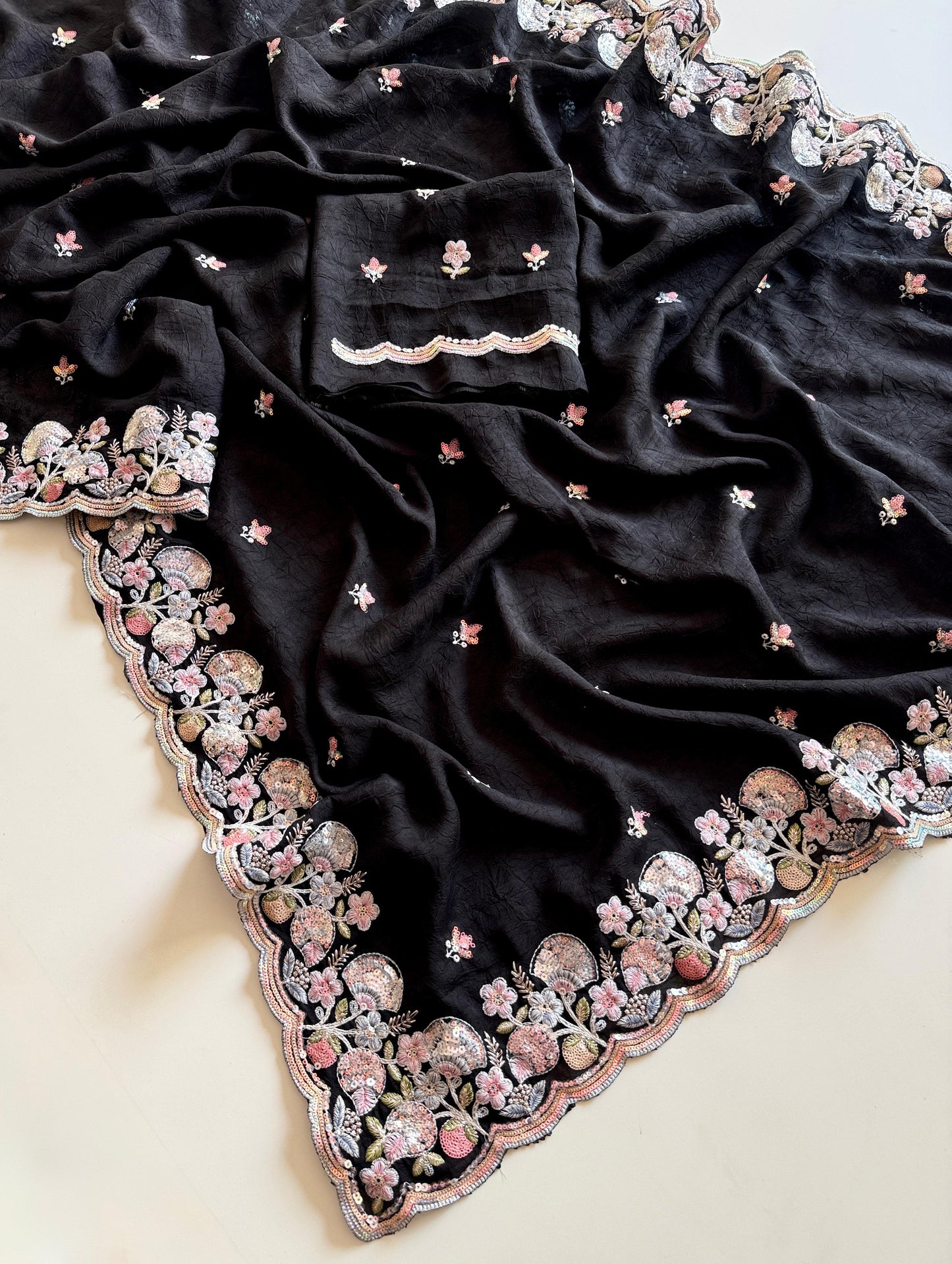 Black fabric with intricate floral embroidery on a light background-Multicolor 4m sequin embroidery saree with soft lightweight fabric