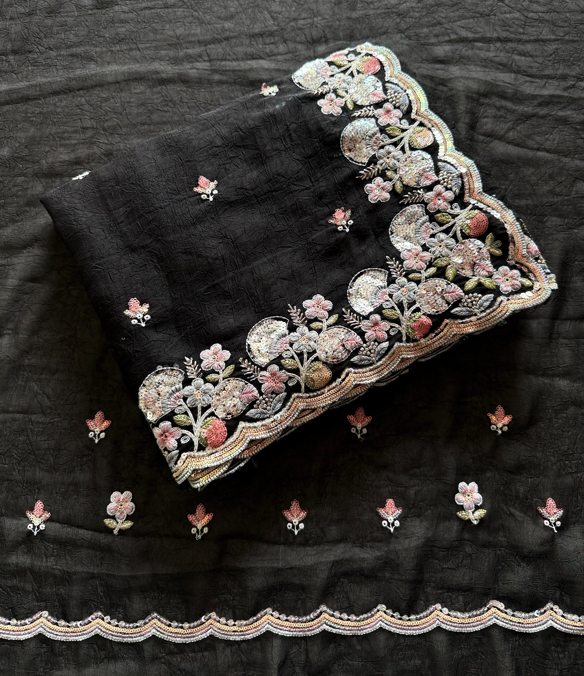 Black fabric with intricate floral embroidery on a dark background-Multicolor 4m sequin embroidery saree with soft lightweight fabric