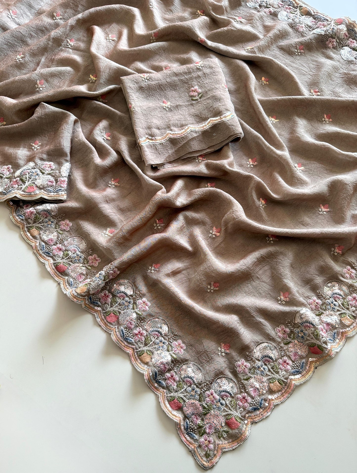 Brown fabric with floral embroidery on a white background-Premium designer sequin saree in crush silk with embroidery blouse