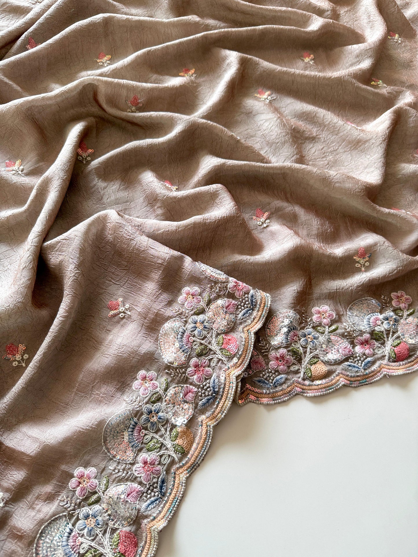 Brown fabric with floral embroidery on a white background-Premium designer sequin saree in crush silk with embroidery blouse