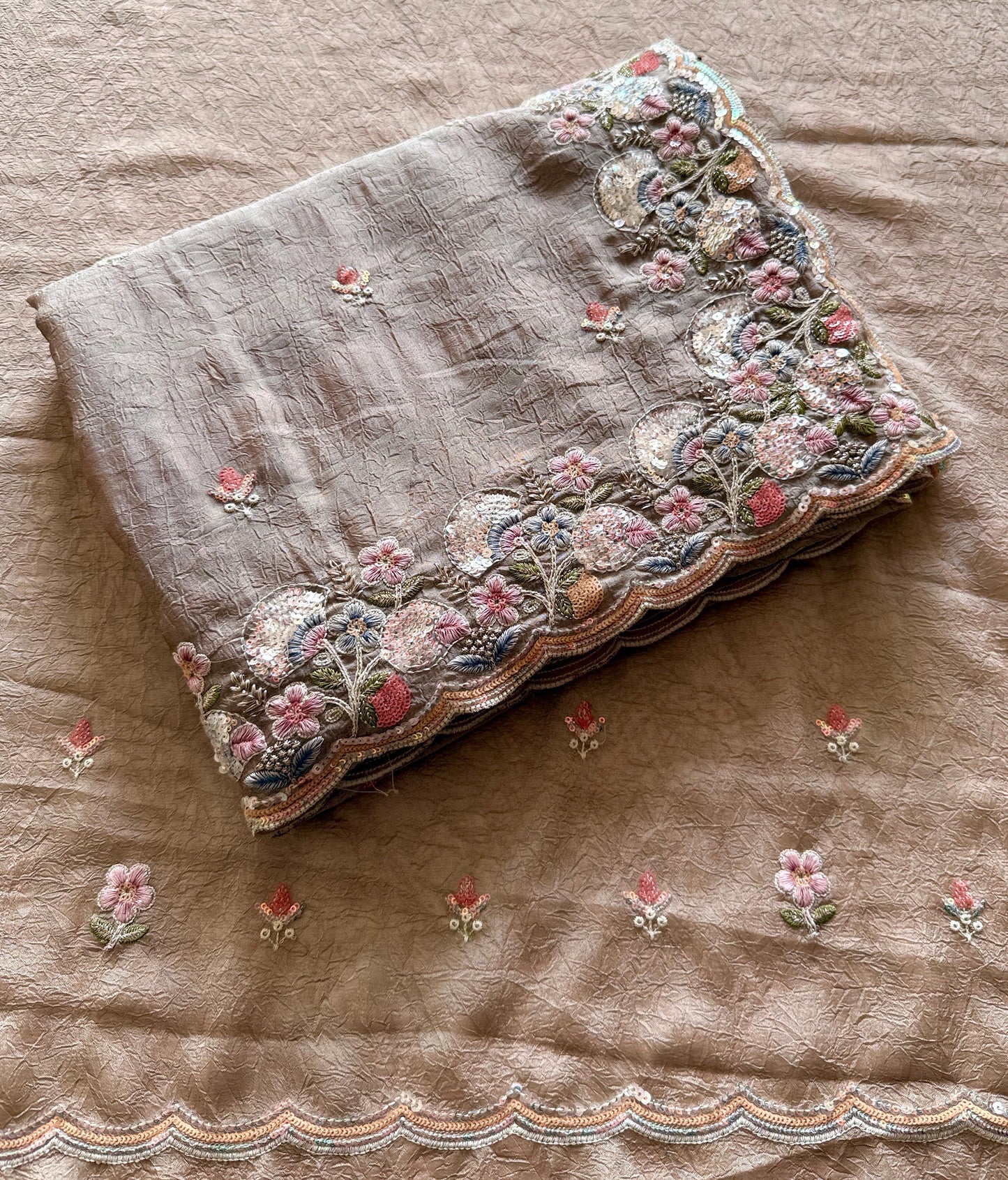 Embroidered fabric with floral patterns on a brown background-Premium designer sequin saree in crush silk with embroidery blouse