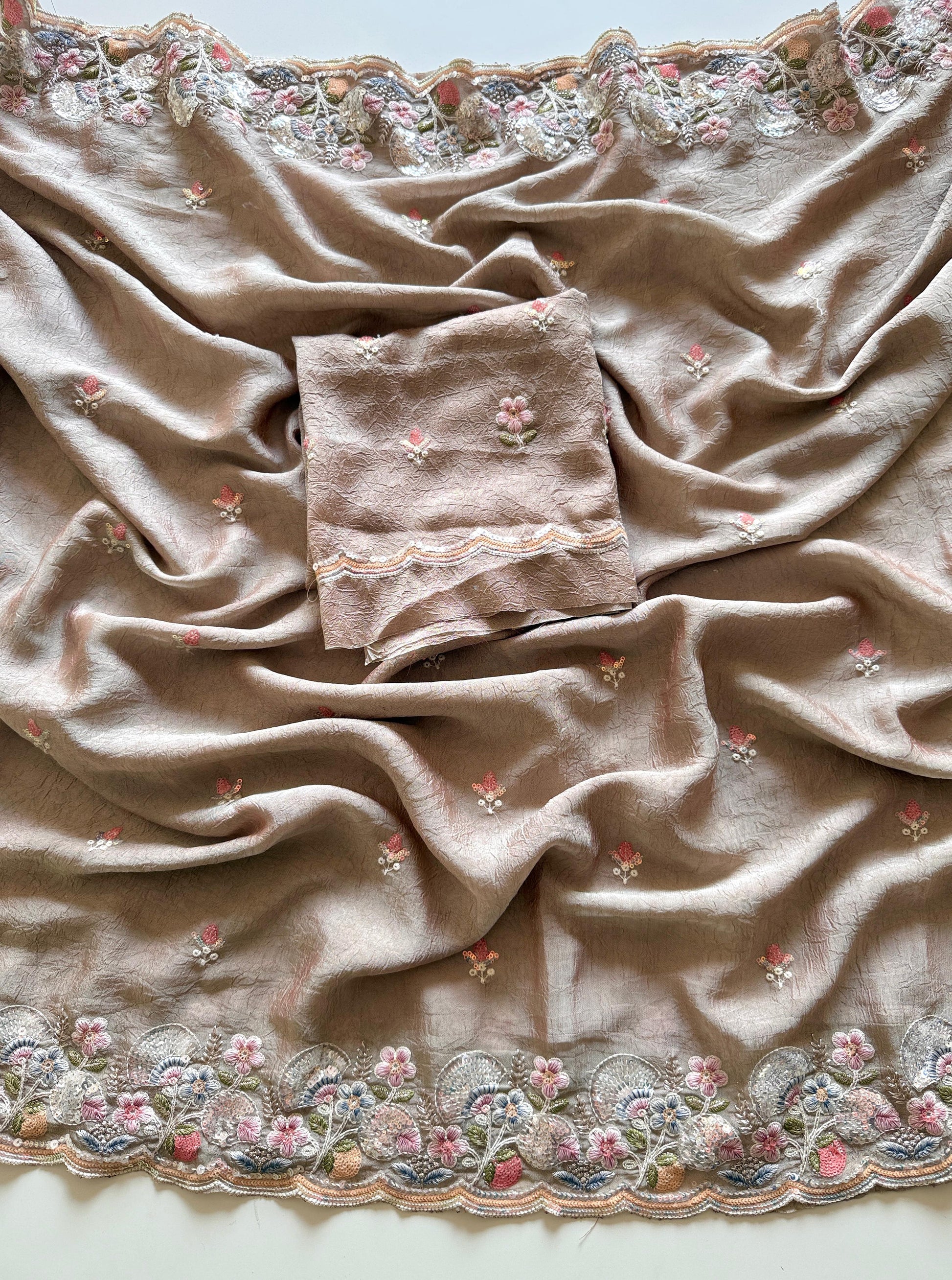 Beige fabric with floral embroidery on a plain background-Premium designer sequin saree in crush silk with embroidery blouse