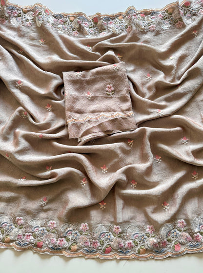 Beige fabric with floral embroidery on a plain background-Premium designer sequin saree in crush silk with embroidery blouse