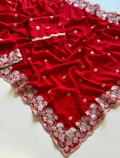 Red fabric with intricate silver embroidery on a white background-Soft crush silk saree with multicolor sequin embroidery