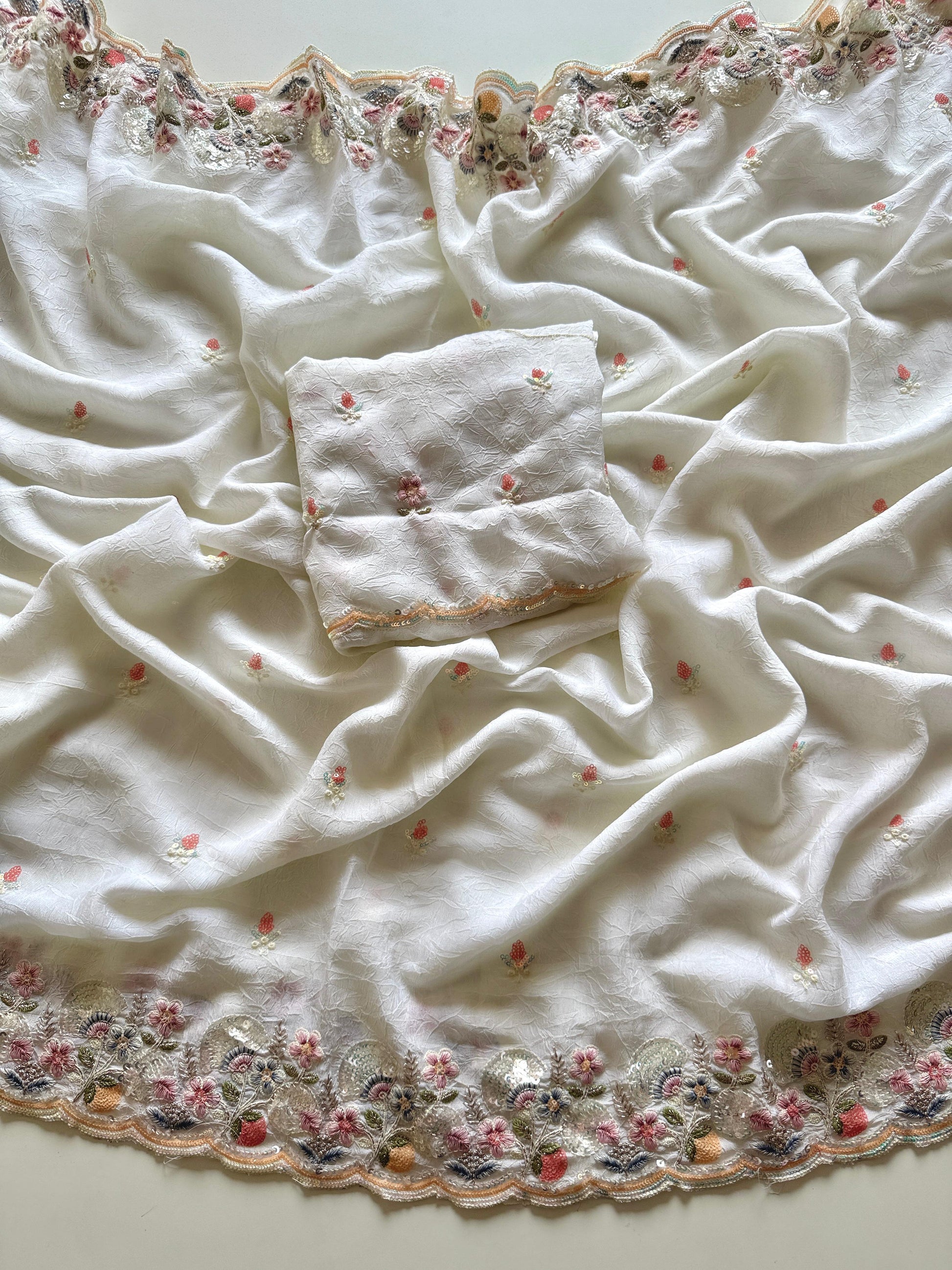 White fabric with floral embroidery on a light background-Multicolor 4m sequin embroidery saree with soft lightweight fabric