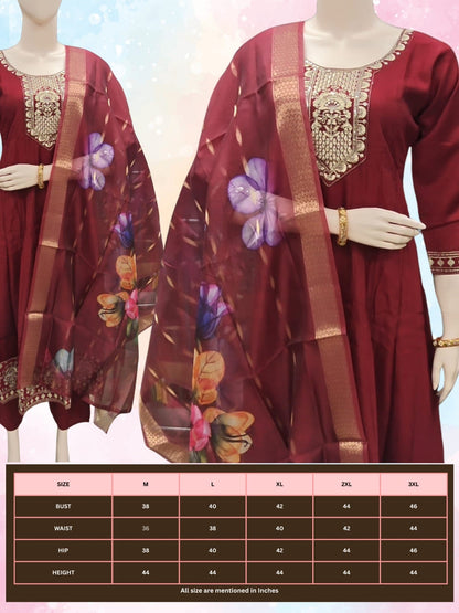 Maroon traditional outfit with floral dupatta on mannequin against a light background
